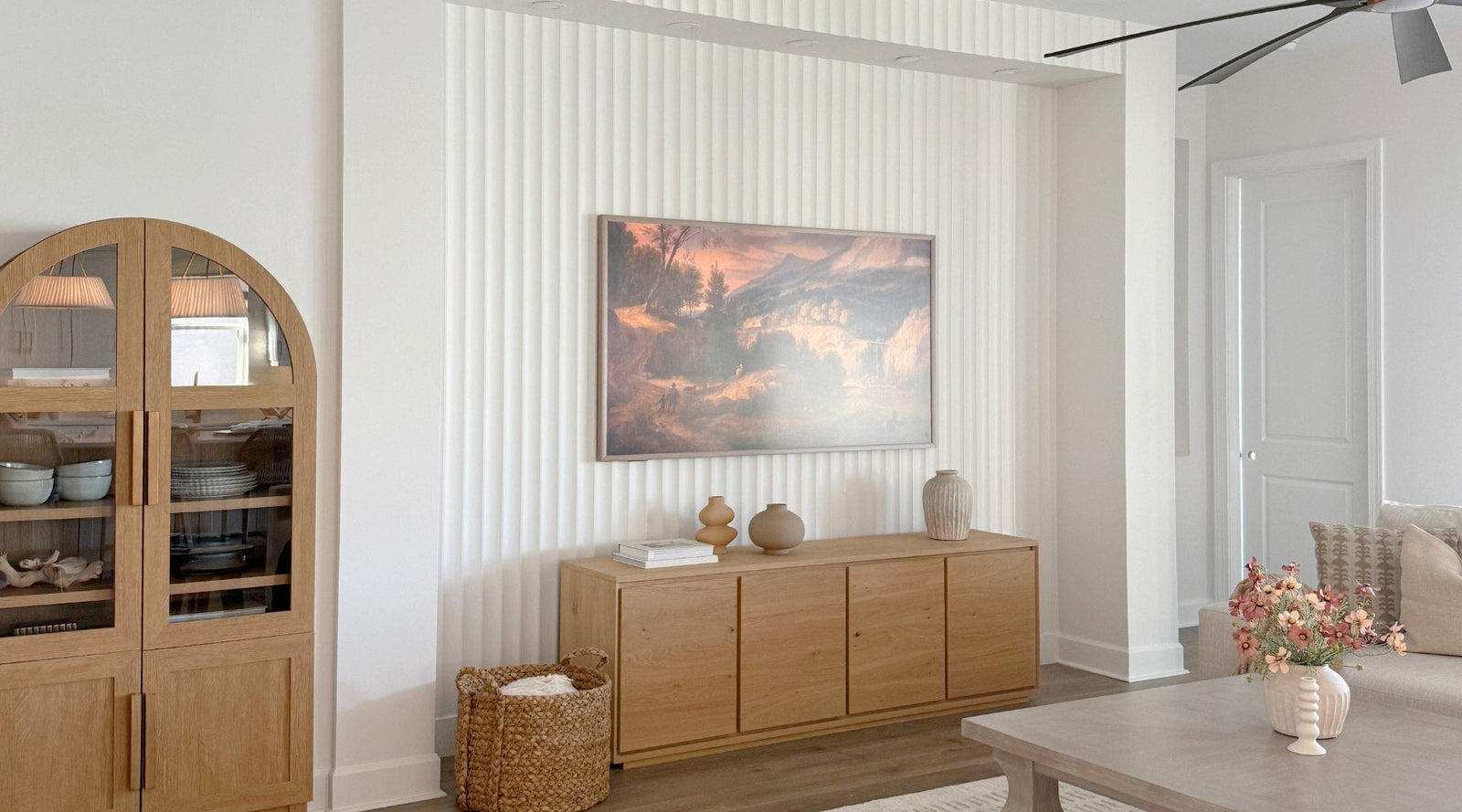 Primed paintable fluted wall panels installed in a modern living room tv wall