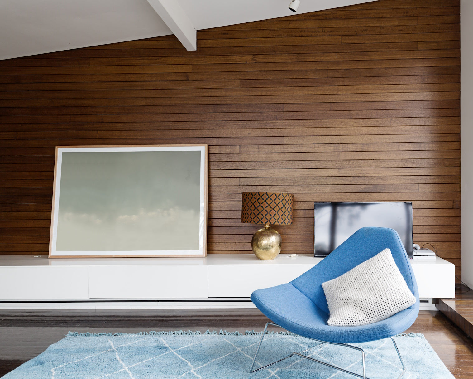 mid century style living room with wood paneling
